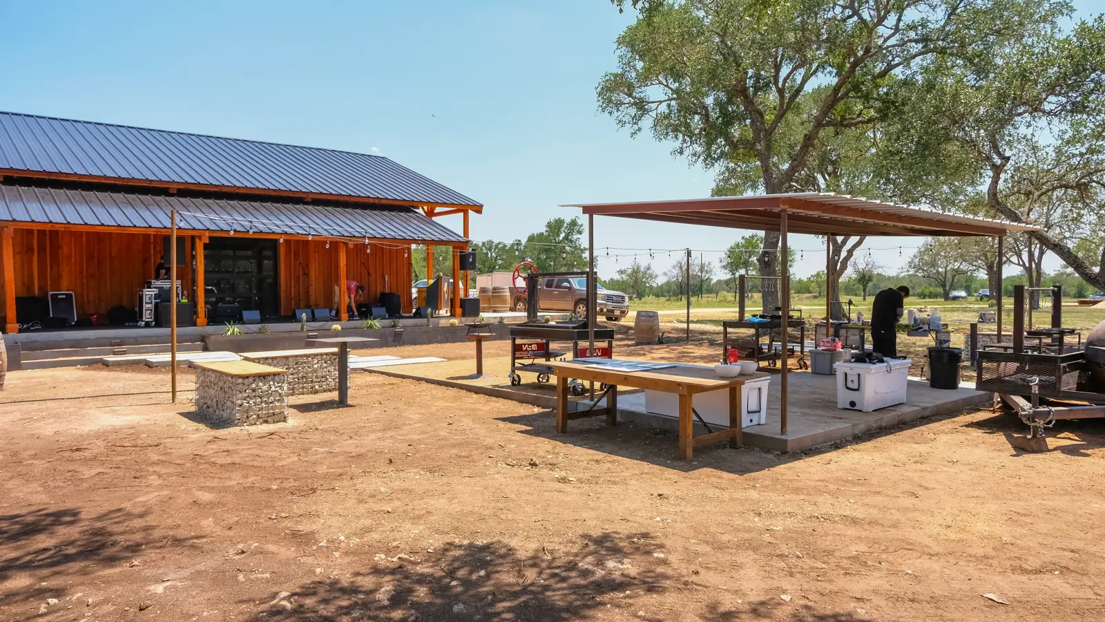 Ranch building and outdoor event gathering space.