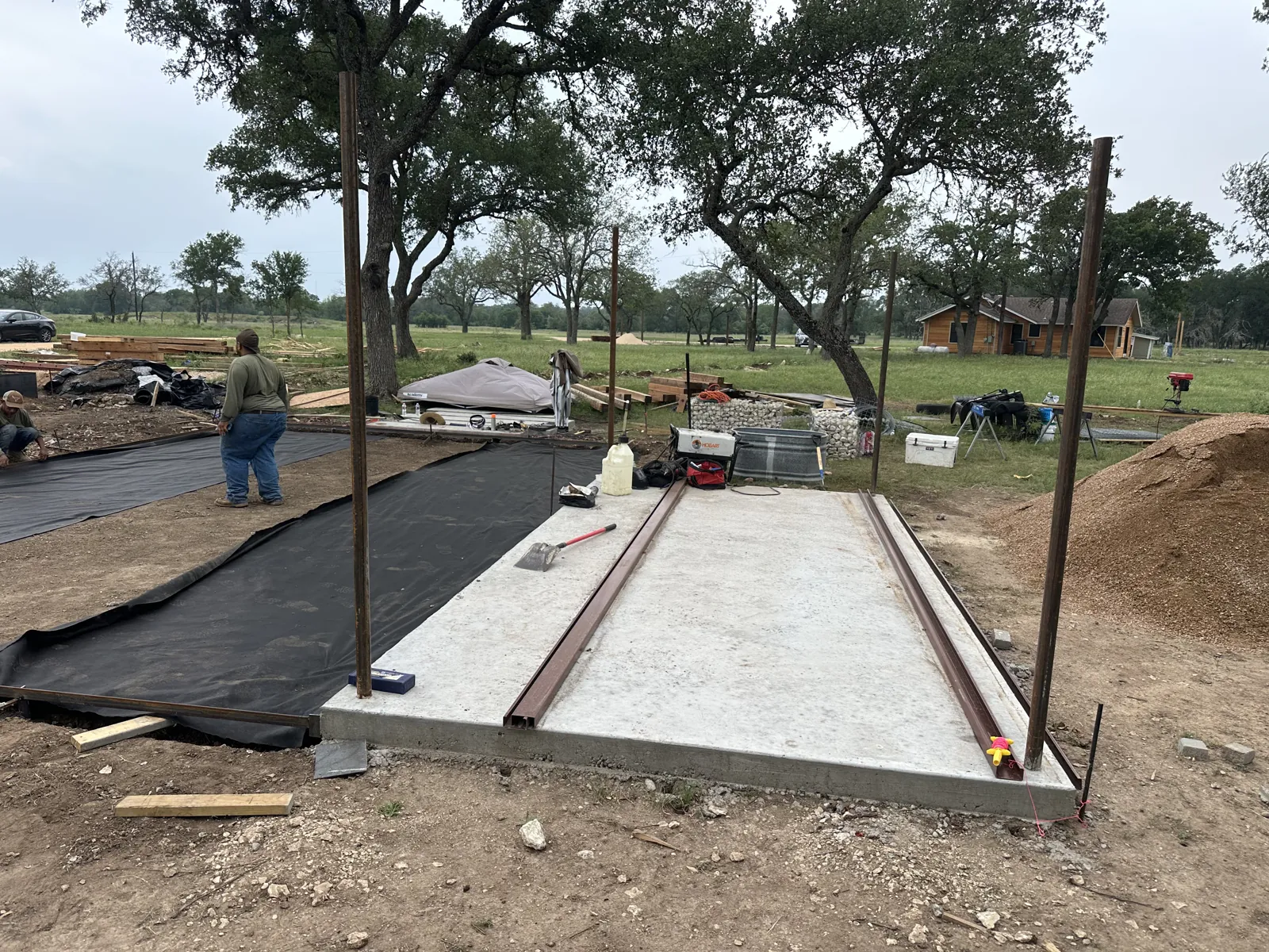 During construction: preparation of the covered-area concrete pad.